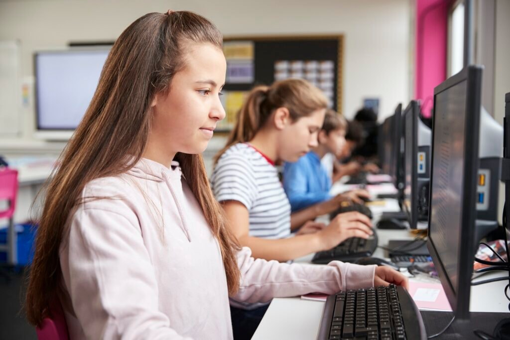 Students working at computers in a school computer class